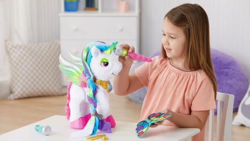 Girl playing with Myla the Magical Unicorn