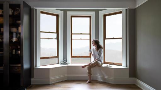 Woman sitting by her 3 large beautiful.