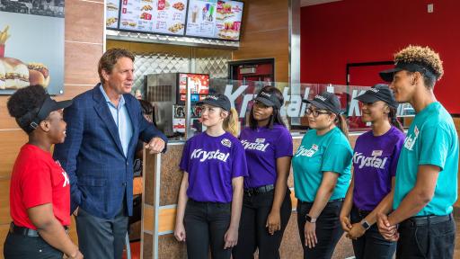 Michael Klump, Chairman of Krystal and CEO of Argonne Capital Group with Krystal employees