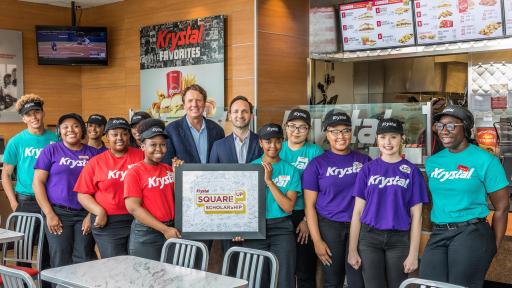 Several employees standing inside a Krystal resturant