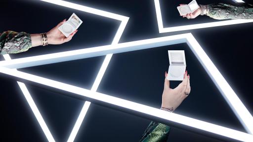 Hands holding Space Baby highlighter product