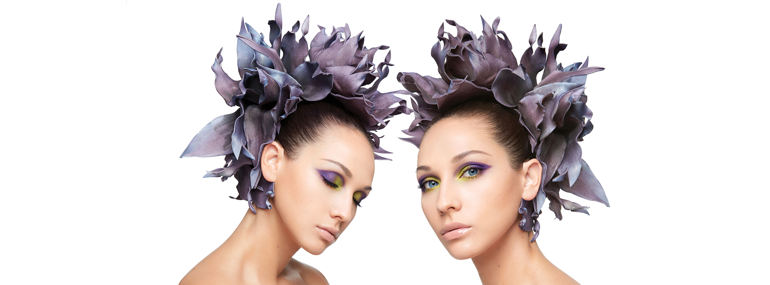 Two women in makeup facing each other