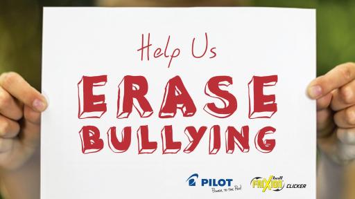 Kid holding up sign that reads "Help us erase bullying"