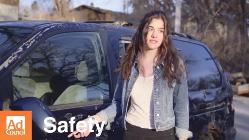 Woman standing outside a van.
