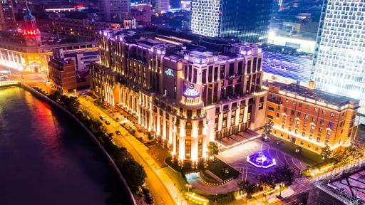 Exterior View of Bellagio Shanghai lit up with lights at night.