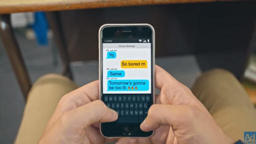 Kid texting on phone in the classroom.
