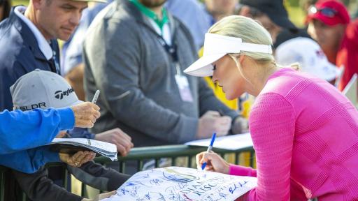 Blair O&rsquo;Neal signing a fan&rsquo;s poster