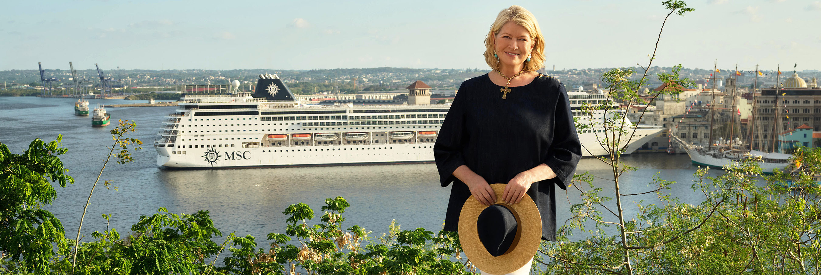 Martha Stewart in front of ship