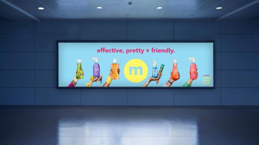 A lighted method billboard in a train station wall glowing in the dark.