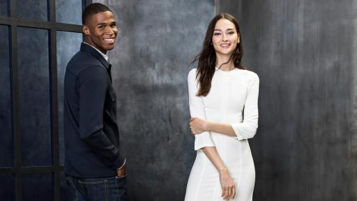 Man and a woman modeling shoes