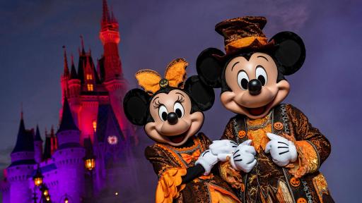 Mickey and Minnie Mouse dressed in Halloween garb.