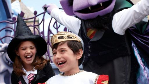 Two children standing with Count Dracula