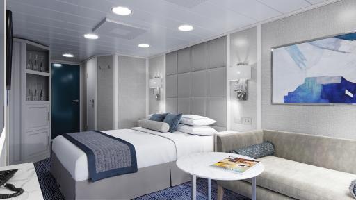 The Concierge Veranda Stateroom bedroom with cool colors and a bed in the center of the room.