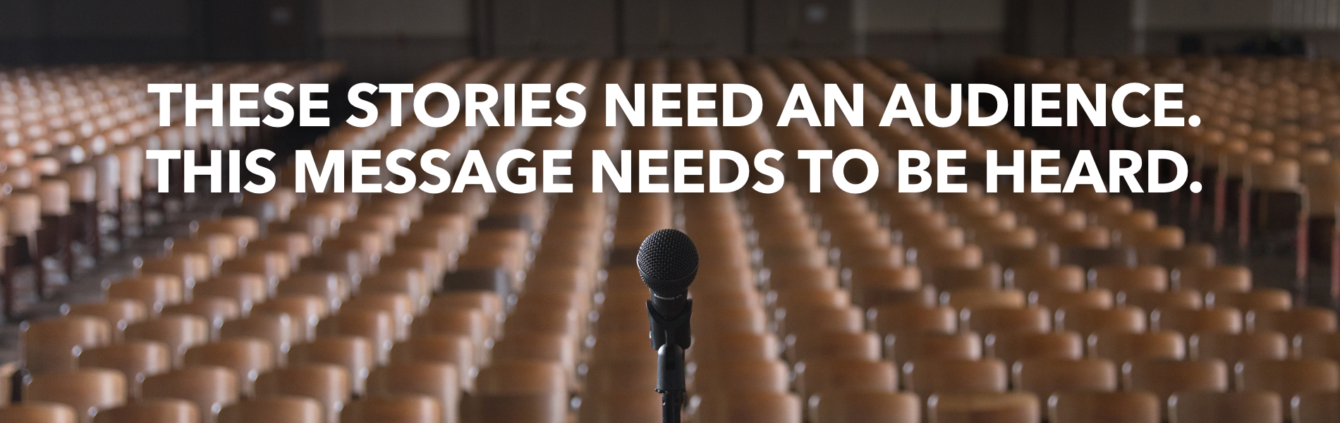 Microphone with a backdrop of empty seats