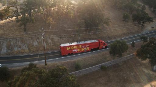 Action shot of the Denny's Mobile Relief Diner on the road