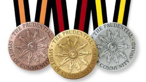 A bronze, gold and silver medallion in a row on a white background.