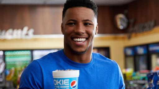 Saquon Barkley holding a cup of Pepsi
