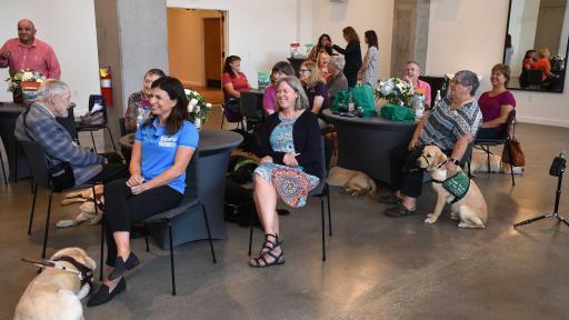 Group in room laughing