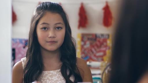 Girl looking in mirror