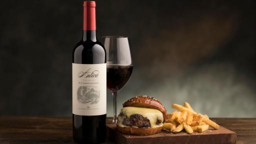 Cheeseburger and glass of wine