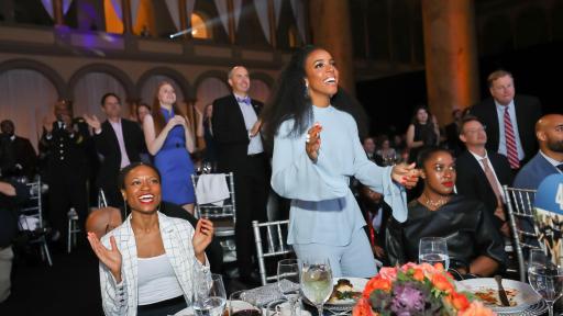 Group clapping during award ceremony