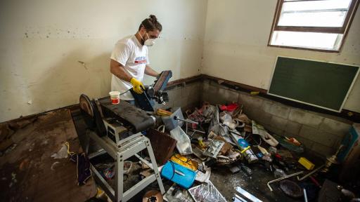 Volunteer cleaning up house hit by Hurricane Florence