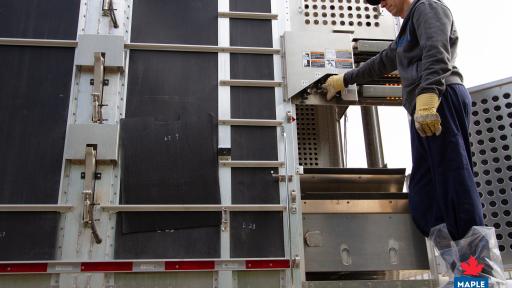 Truck operator using a hydraulic floor lift truck