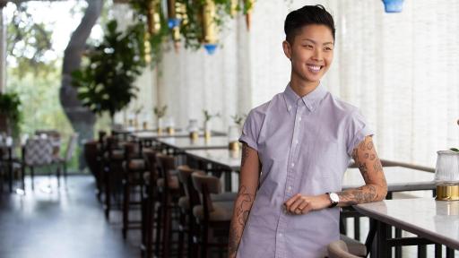 Kristen Kish standing in restaurant