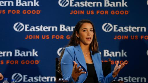 Aly Raisman, Eastern Bank’s newest Partner for Good, addresses a crowd in Boston on October 16, 2018.