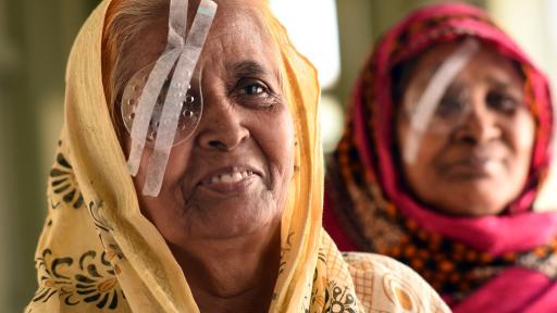 A woman smiles after a cornea transplant in Bangladesh.