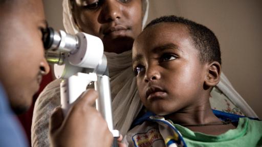 A boy with cataracts is examined by Orbis Volunteer Faculty in Ethiopia.