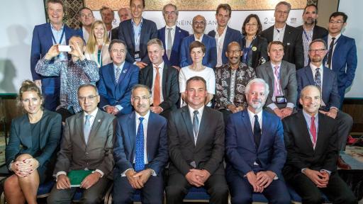 SC Johnson Chairman and CEO Fisk Johnson (first row at far right) today, Monday 29th October, 2018, on stage with Ellen MacArthur and other delegates at the signing of the New Plastics Economy Global Commitment at the 2018 Our Ocean Conference in Bali, Indonesia. (Graham Crouch/AP Photography for SC Johnson)