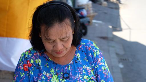 Woman putting a used plastic bottle into a bag