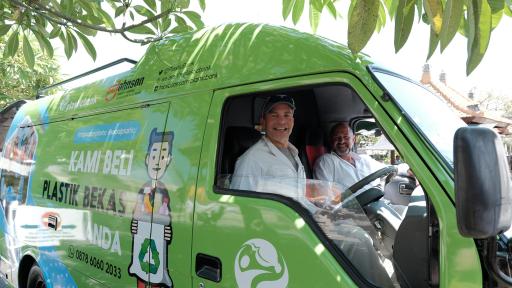 Fisk Johnson, Chairman and CEO of SC Johnson and David Katz, CEO of Plastic Bank, riding in the mobile collection center van.
