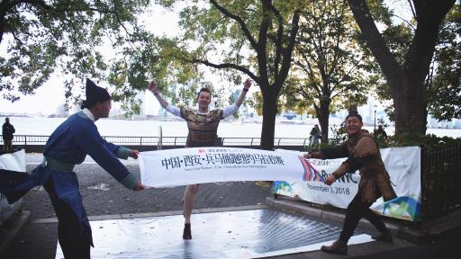 First place finisher, Ted Brakob, crosses the Xi'an Warrior Run finish line