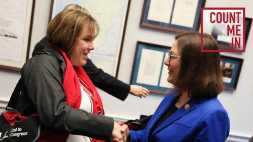 Two women greeting