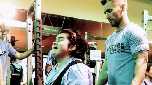Coached and supported by trainers, Special Olympics athletes perform deadlifts at Anytime Fitness in Vancouver, WA