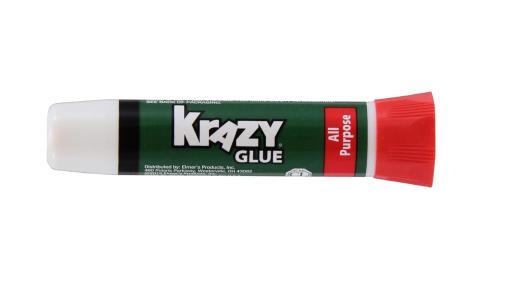 A tube of Krazy Glue on a white background
