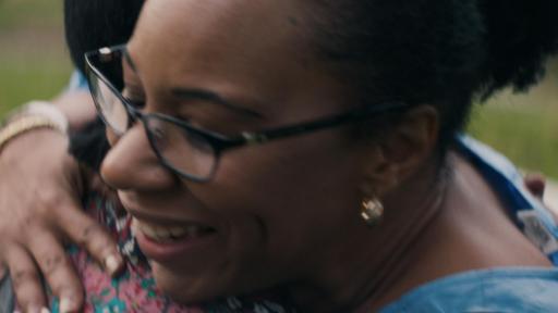 Two women hugging and greeting