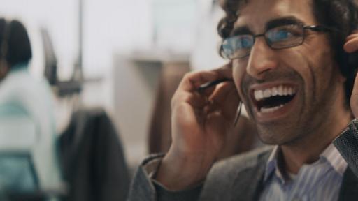 Guy on headset smiling