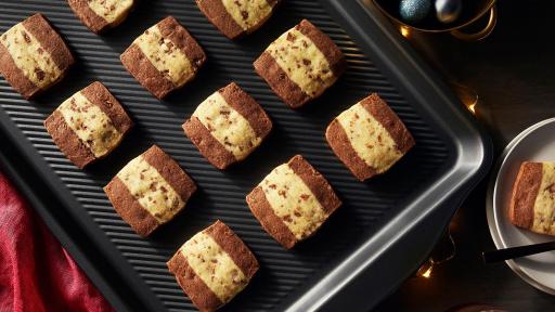 Made from heavy gauge carbon steel, these baking sheets are designed with a textured surface that increases airflow. This ensures heat is transferred evenly and helps avoid soggy or stuck-on foods so you get delicious results. At 0.8 mm thick, they&rsquo;ll withstand heat without warping in the oven &ndash; the perfect addition or upgrade for your bakeware collection.