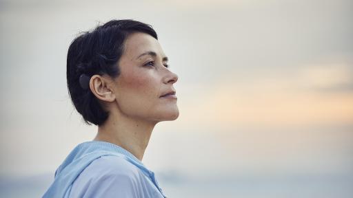 Adult woman recipient of Cochlear Osia 2 System, a new hearing implant system for people with SSD, conductive or mixed hearing loss.