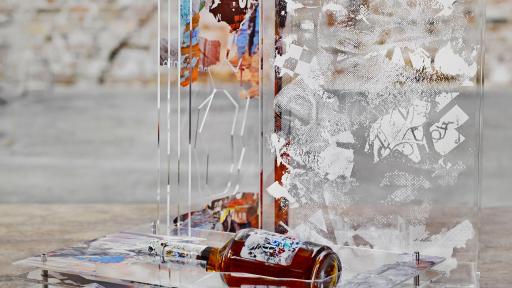 Bottle next to artwork