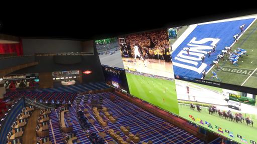 multi-level, stadium-style sportsbook, equipped with large screens