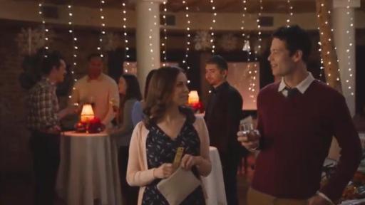 Man and women talking at a party