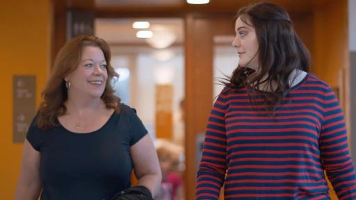 Emma Collins walking and looking at friend