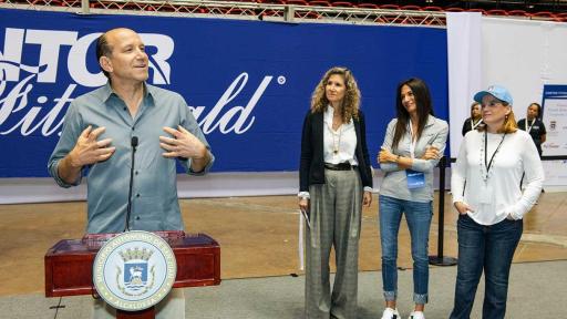 Howard Lutnick, Cantor Fitzgerald Chairman & CEO, Edie Lutnick, President of Cantor Fitzgerald Relief Fund and Allison Lutnick, Director of Disaster Relief Efforts are photographed with students and administrators of the the San Gabriel School of the Deaf.