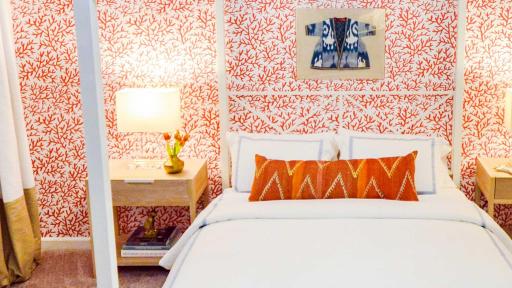 Kevin O&rsquo;Gara&rsquo;s master bedroom features lease-friendly patterned wallpaper and an elegant LED chandelier along with his one line of maze-inspired area rugs.