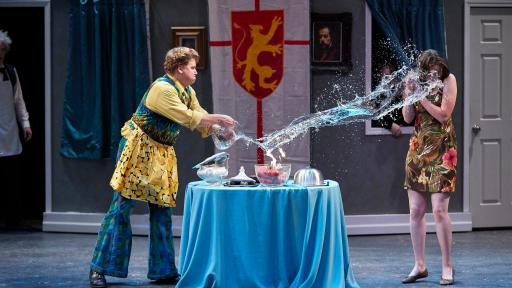 Man splashing woman with water