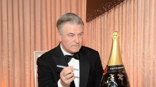 Alec Baldwin adds signature to Champagne Taittinger’s bottle activation at the 25th Annual Screen Actors Guild Awards on January 27, 2019.